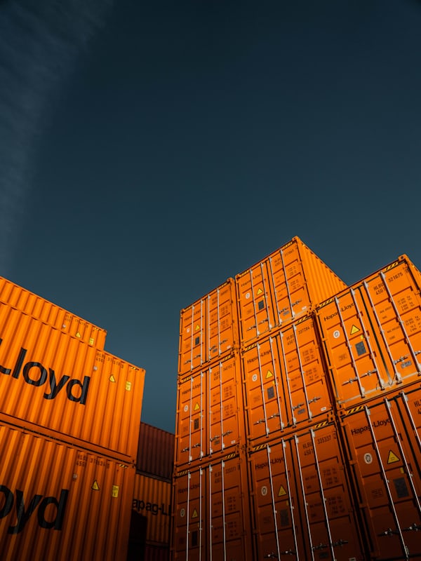 Stacked shipping containers — storage and logistics inventory metaphor for Amazon FBA fee planning